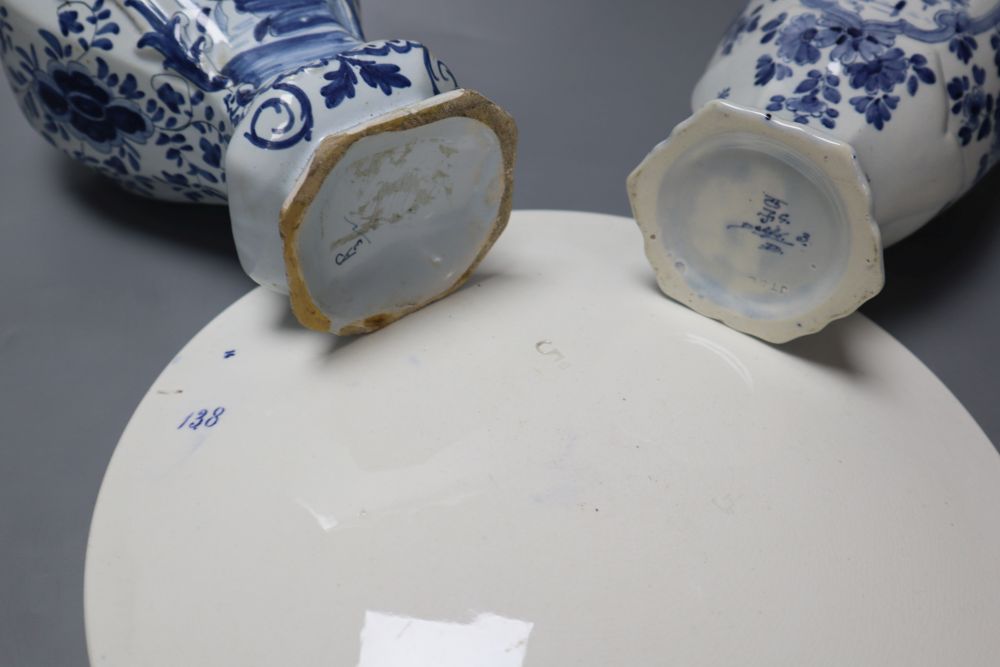 A delftware vase, 22cm, delft vase and a painted wall plate, 26cm